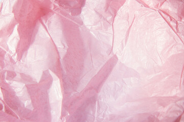 Fototapeta premium Abstract bright pink background. Squeezed multicolored craft paper.