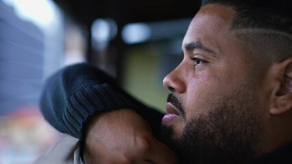 A depressed young man thinking about life an unhappy person