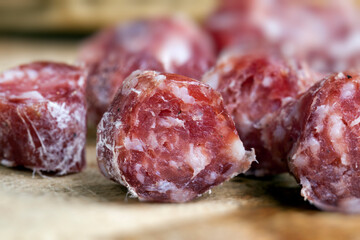 sliced sausage of dried meat with bacon