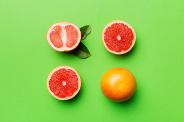 fresh Fruit grapefruit with Juicy grapefruit slices on colored background. Top view. Copy Space. creative summer concept. Half of citrus in minimal flat lay with copy space