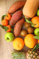 Various healthy fruit and vegetable on wooden background. Top view.