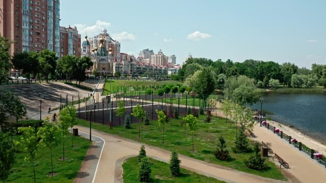 Aerial drone view on Kyiv city residential area and Dnipro River. Obolonskyi District. Suburb recreational zone.
