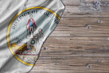 United States country state Seal District of Columbia on old wooden pattern table board
