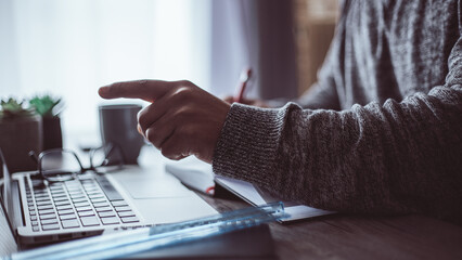 young person working from home by video call and looking at annotations