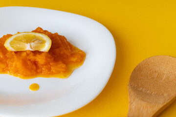 natural pumpkin porridge with lemon slice, healthy food, diet food