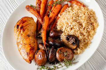 Restaurant meal of grilled chicken, close-up