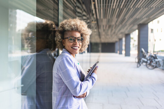 Young Black Business Woman Worker Of New Creative Modern Company Standing In Outdoors Office Area Holding Laptop