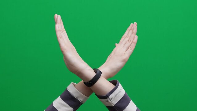 Crossed hands. Break the bias symbol of woman's international day. Woman arms crossed to show solidarity, commitment to calling out bias, breaking stereotypes, inequality, rejecting discrimination