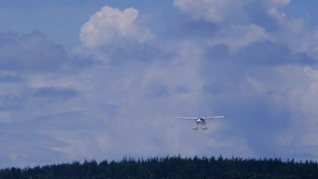 Slow motion view of a float plane landing near Le Morne in Mauritius