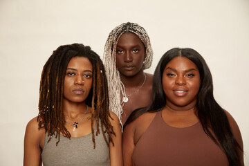 Studio portrait of three women - Powered by Adobe