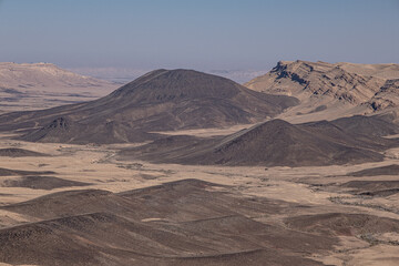 View of Ramon Crater from West to East as seen from Mount Ramon, a 500 m deep, the world's largest erosion cirque, located in the Negev Desert, south of Beer Sheba, Israel.	
