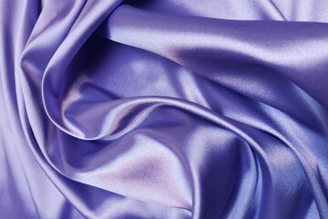 Violet crumpled or wavy fabric texture background. Abstract linen cloth soft waves. Silk atlas or stretch jacquard. Smooth elegant luxury cloth texture. Concept for banner or advertisement.