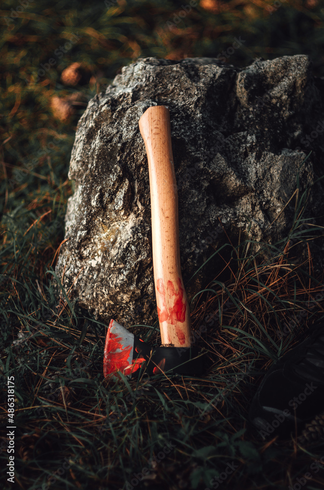 Wall mural axe holding a stone