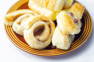 Set of various traditional pastry sweet mini Danish on the brown plate