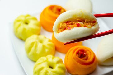 BBQ Jackfruit Bao Buns, Steam cooked seasoned jackfruit and vegetables, coated in a barbecue-style sauce and wrapped in a dough bun