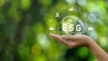 ESG icon concept. Environment in renewable hands. Nature, earth, society and governance SG in...