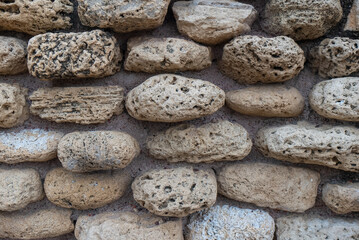 Fototapeta na wymiar Background texture of stone wall. Natural stone, a wall of natural stone.