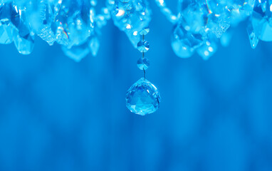 chandelier crystal elements on blue background