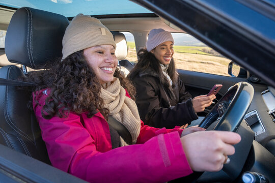 Female friends traveling by car