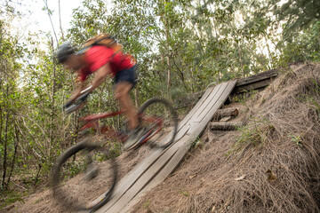 Man going downhill on a mountain bike with motion blur