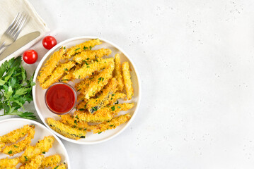 Crispy fried zucchini sticks and tomato sauce