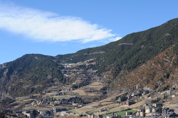 Fototapeta na wymiar Encamp town in the Valira d'Orient river valley at the foot of Grandvalira resort in Andorra in Pyrenees mountains range in winter