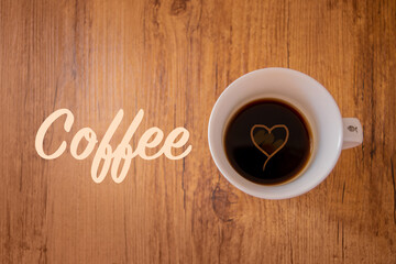 cup of coffee on wooden background