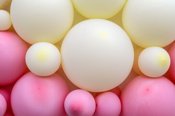 Balloons background, pastel color and soft focus. pink and milk balloons. wall decoration for birthday or holiday