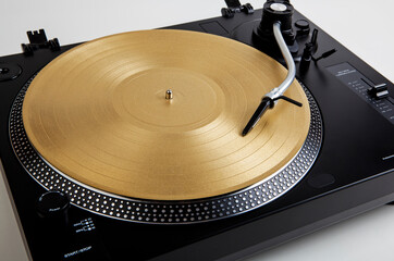 A needle on a turntable that plays music