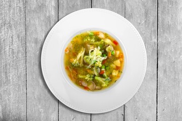 The tasty Spicy soup on wood table