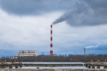 Fototapeta na wymiar Chimney emits acrid toxic smoke global environmental pollution ecology and sky air combined heat and power plant industrial plant zone