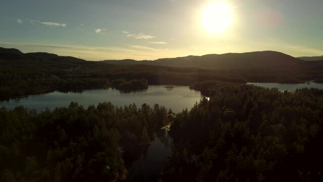 Lake sandvatn sunset flying reflection golden hour Norwegian Forest 4K 30fps
