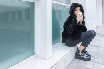 Woman with a take away coffee