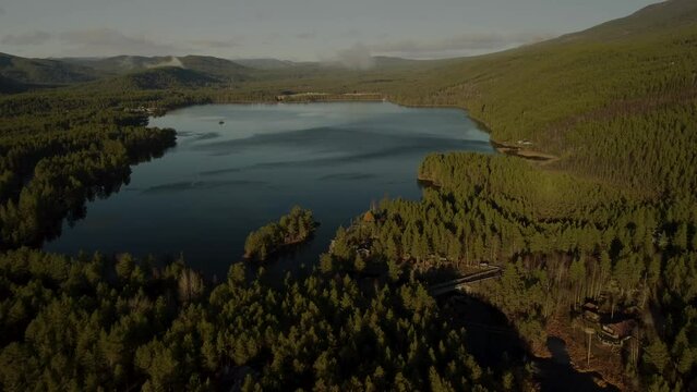 Flying over lake Sandvatn Bridge Sunset Goldenhour Norway View 4K 30fps