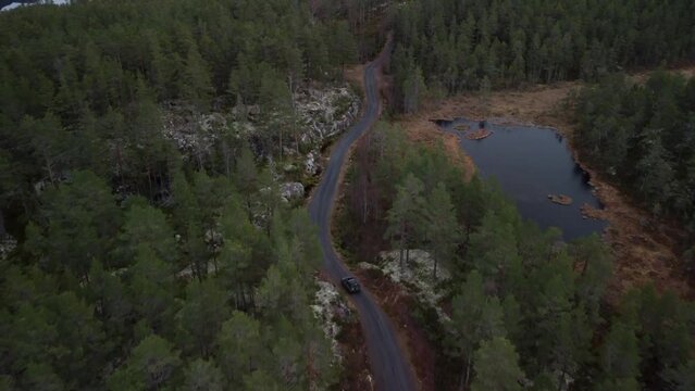 Follow Landrover Driving Over Norwegian S Road Forest Lakes 4K 30fps