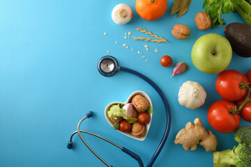 Natural dietary medicine with healthy food and stethoscope on blue