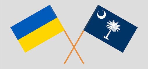Crossed flags of Ukraine and The State of South Carolina. Official colors. Correct proportion
