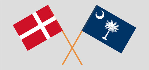Crossed flags of Denmark and The State of South Carolina. Official colors. Correct proportion