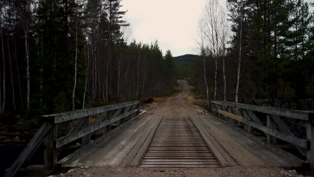Drone Landing Norwegian Wooden Bridge Dark Forest 4K 30fps