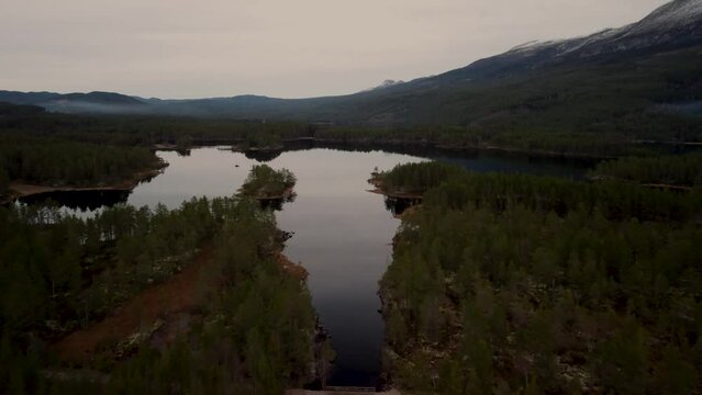 Flying Over Bridge Lake Holmevatn Wide View Mountain Forest Norway 4K 30fps