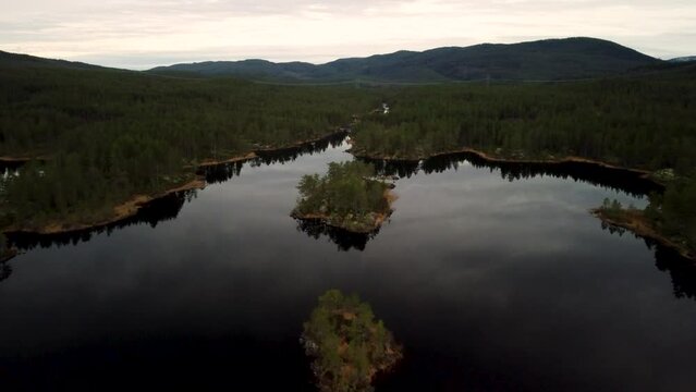 Going Over Lake Holmevatn Norway Islands 4K Drone Reflection Dark 30fps