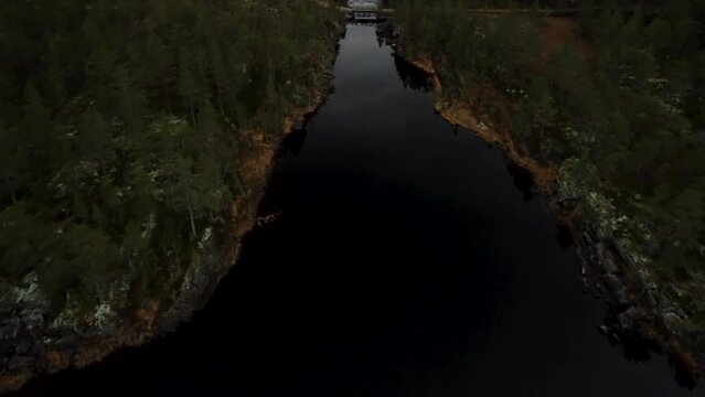 Downward View Lake Holkae Holmevatn Wooden Bridge Norway Dark Forest 4K 30fps