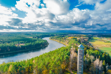 Fototapeta na wymiar Tallest Lithuanian observation view tower in Birstonas resort in autumn on the shore of Nemunas river
