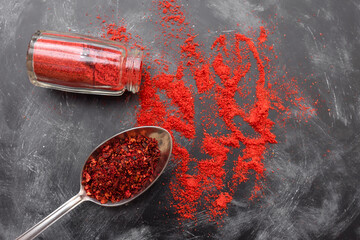 Paprika and tomato spice on the kitchen table, top view