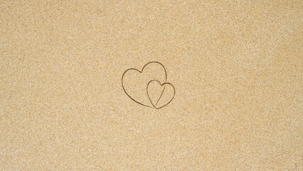 Hand-drawn shape of two heart on sand tropical beach. valentines day. Holiday concept. Creative, background, copy space, travel, summer. Flat lay