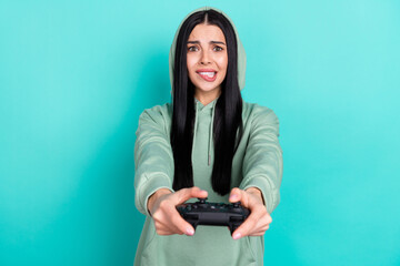 Photo of sad millennial brunette lady playstation wear green sweatshirt isolated on teal color background