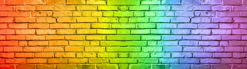 Abstract rainbow colors colored damaged rustic brick wall brickwork stonework masonry texture background banner panorama..