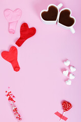Concept gifts for your loved ones, for valentines day, womens day, mothers day or birthday. Two cups of cocoa marshmallow in shape of heart and candy. Copy space. Top view
