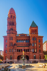 Sunny view of Courthouse building and Lady of Justice statue