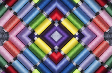 Sewing threads on bobbins in pattern style.